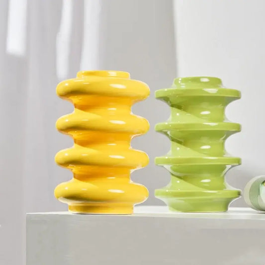 Vibrant yellow and lime green ceramic vase with glossy segmented spiral design for living room geometric circles decorbites geometric circles abstract