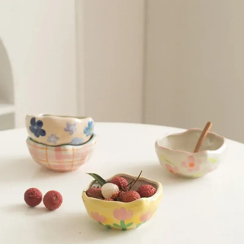 Yellow ceramic salad bowl with pink tulip patterns and lychees in decorbites ceramic salad bowl set