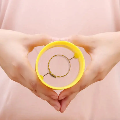 Yellow plastic circular corn peeler tool with metal scalloped ring for textured grip kernel removal by decorbites corn peeler