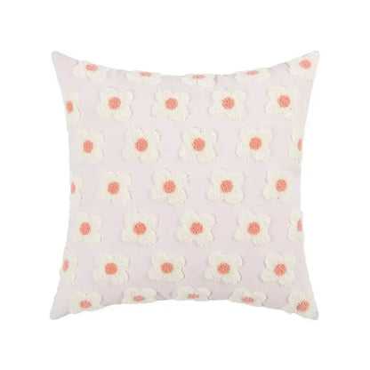 Pastel pink embroidered flora cotton pillow cover with white daisies and coral centers for bedroom sham use