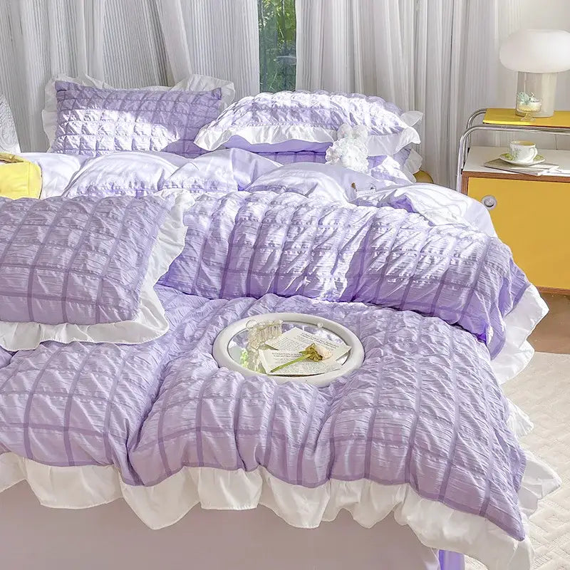 Lavender quilted duvet cover set with white ruffled trim and matching pillows for bedroom bedding cover set
