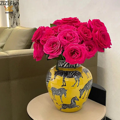 Vibrant yellow ceramic zebra yellow vase with black and white zebra illustrations and artificial flowers for desk decoration