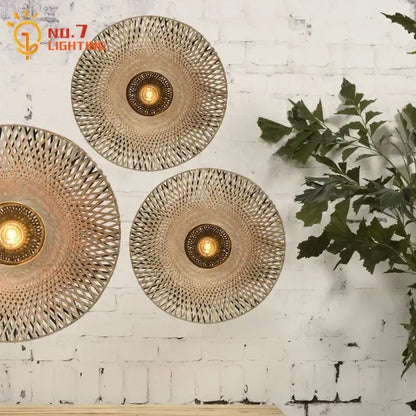 Three circular woven bamboo wall lamps with warm brass centers for living room zen natural bamboo weaving wall lamp